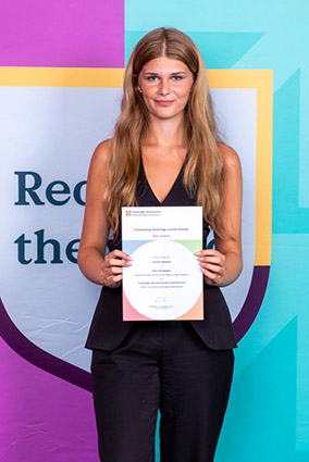 Student with Award Certificate